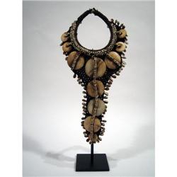 A FINE WEST PAPUAN BRIDAL ORNAMENT,