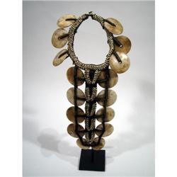 A FINE WEST PAPUAN BRIDAL ORNAMENT,