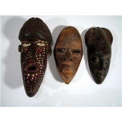 THREE DAN MINIATURE PASSPORT MASKS,