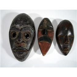 THREE DAN MINIATURE PASSPORT MASKS,