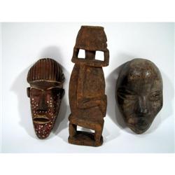 TWO DAN MINIATURE PASSPORT MASKS AND A DOGON SCULPTURE,