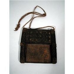 AN OLD NORTH AFRICAN LEATHER TALISMAN,