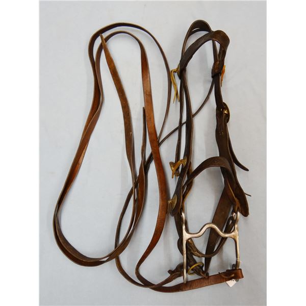 ST stainless grazing bit in fancy flower tooled vintage bridle