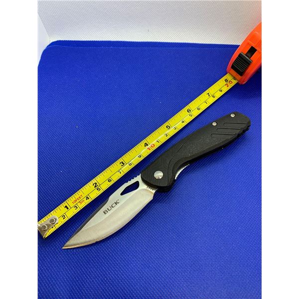 Buck folding pocket knife with clip.