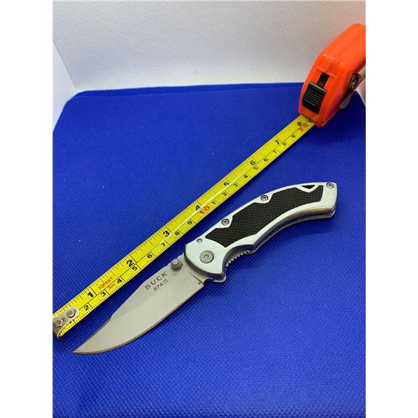 Buck folding pocket knife with clip.