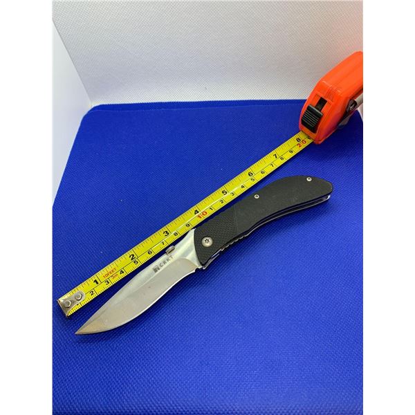 CRKT folding pocket knife with clip.