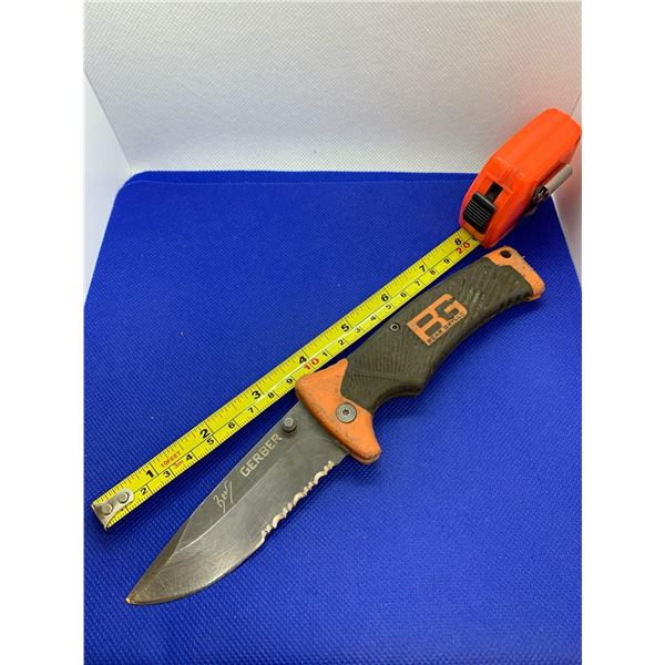 Gerber folding pocket knife with clip.