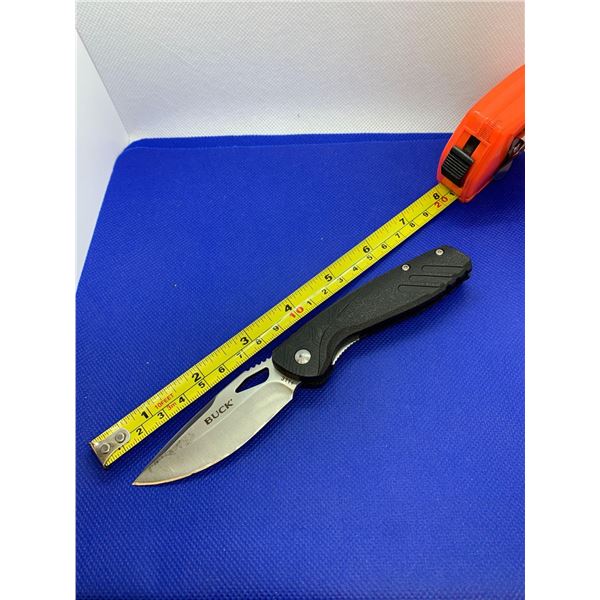 Buck folding pocket knife with clip.