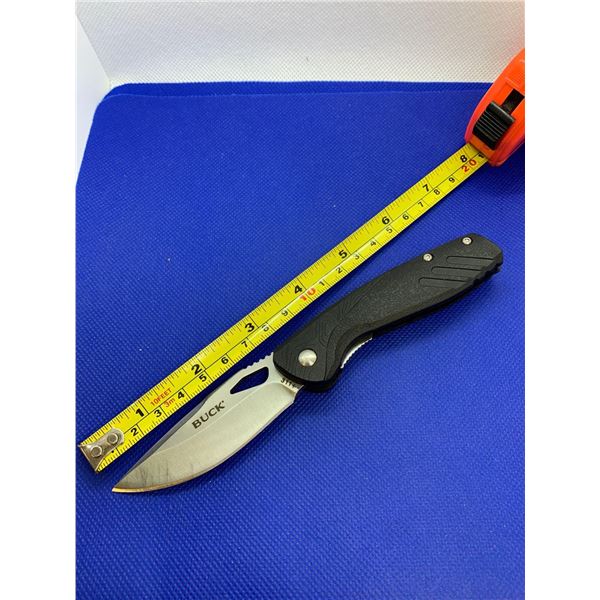 Buck folding pocket knife with clip.