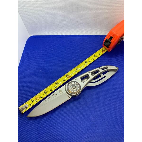 Gerber folding pocket knife with clip.