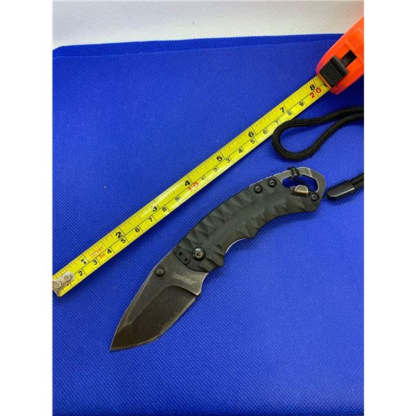 Kershaw folding pocket knife with clip and wrist strap.