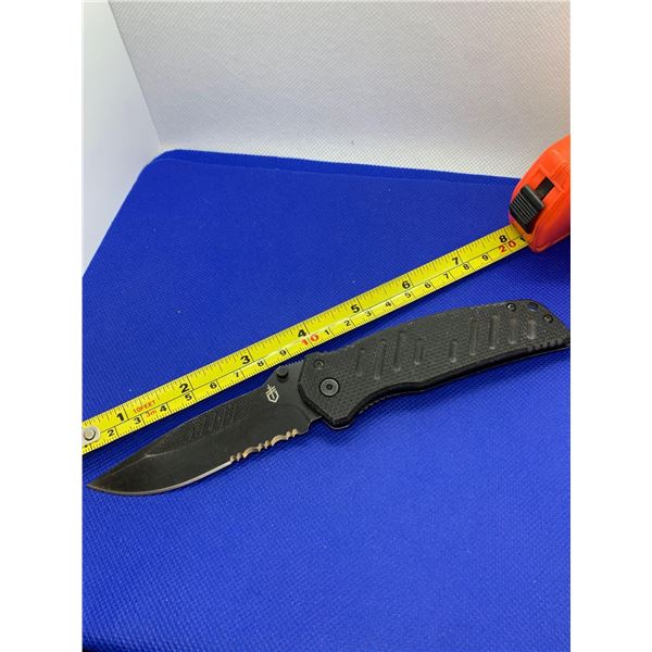 Gerber folding pocket knife with clip.