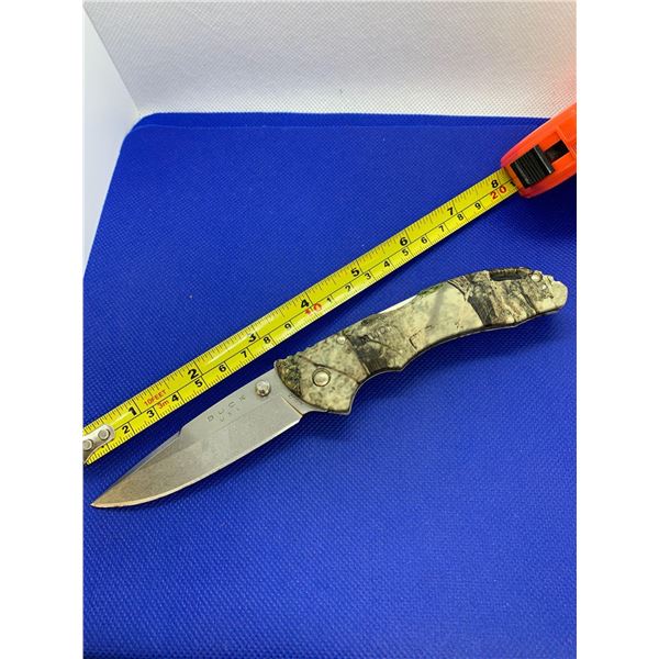 Buck folding pocket knife with clip.