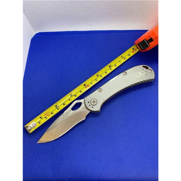 Buck folding pocket knife with clip.