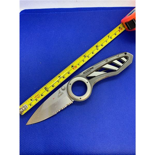 Gerber folding pocket knife with clip.