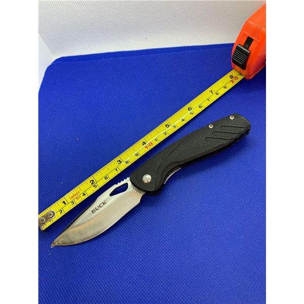 Buck folding pocket knife with clip.
