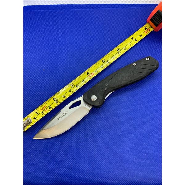 Buck folding pocket knife with clip.