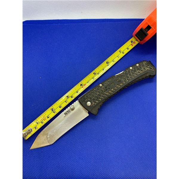 SOG folding pocket knife with clip.