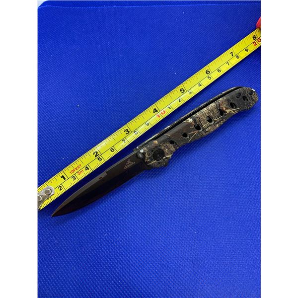 Gerber folding pocket knife with clip.