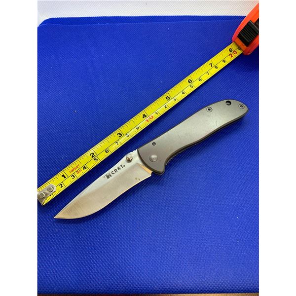 CRKT folding pocket knife with clip.