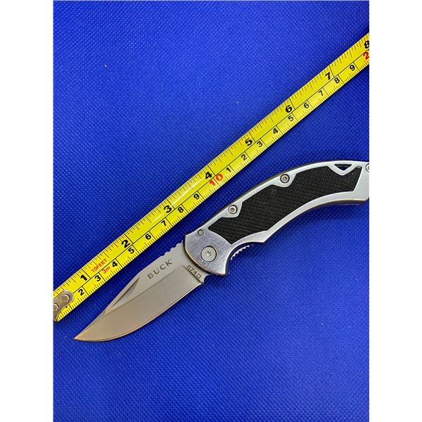 Buck folding pocket knife with clip.