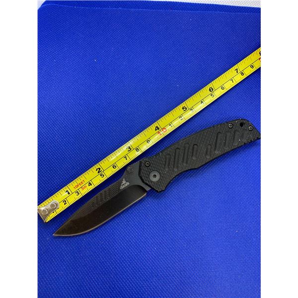 Gerber folding pocket knife with clip.