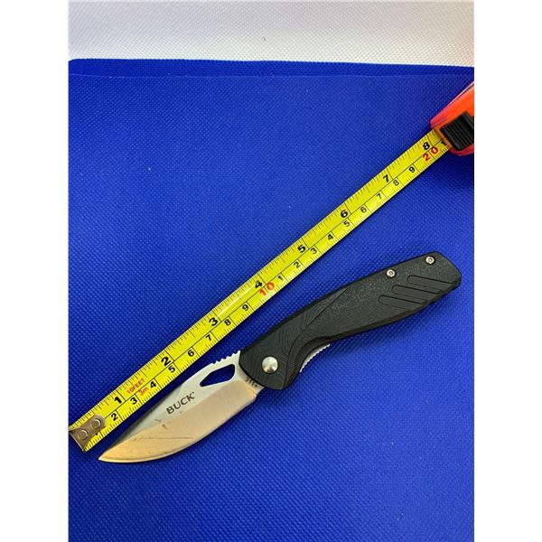 Buck folding pocket knife with clip.