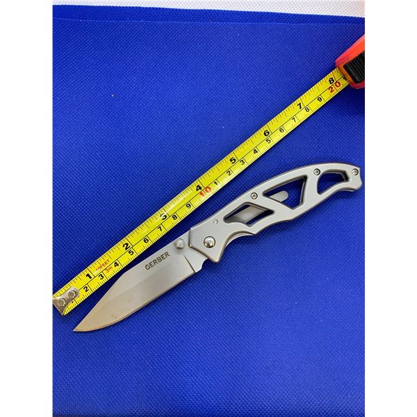 Gerber folding pocket knife with clip.