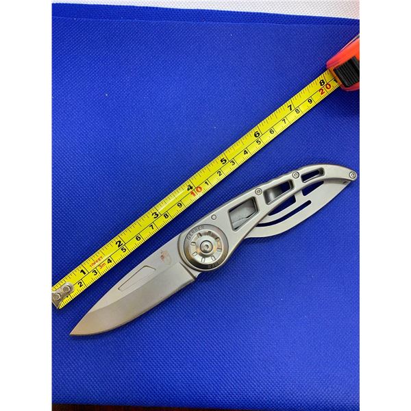 Gerber folding pocket knife with clip.