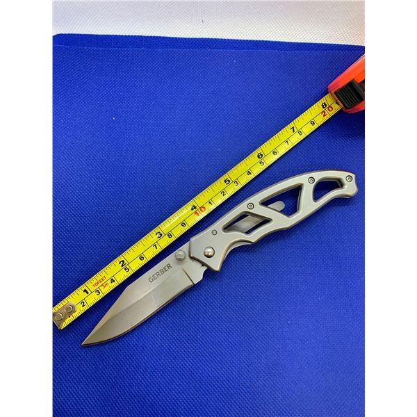 Gerber folding pocket knife with clip.