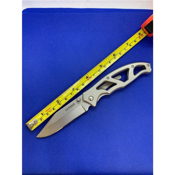 Gerber folding pocket knife with clip.