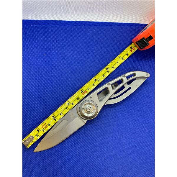 Gerber folding pocket knife with clip.