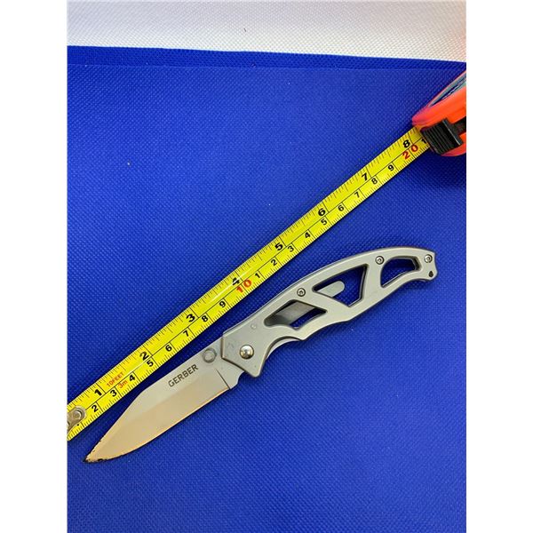 Gerber folding pocket knife with clip.