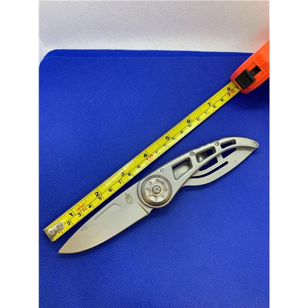 Gerber folding pocket knife with clip.