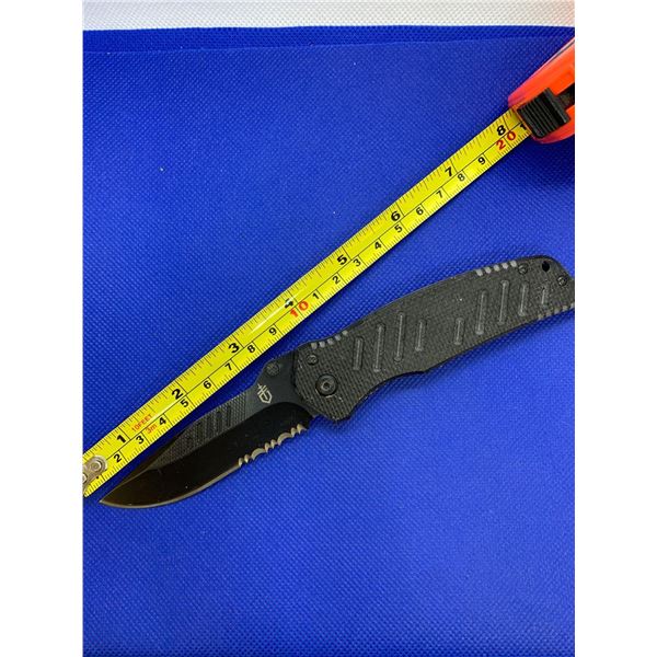 Gerber folding pocket knife with clip.