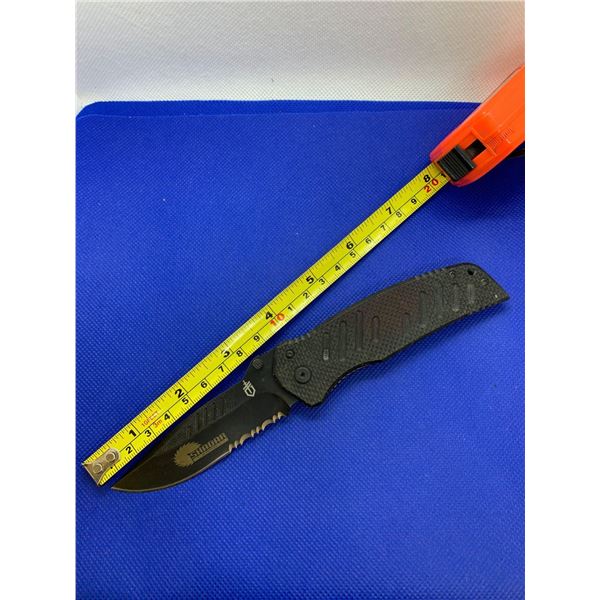 Gerber folding pocket knife with clip.