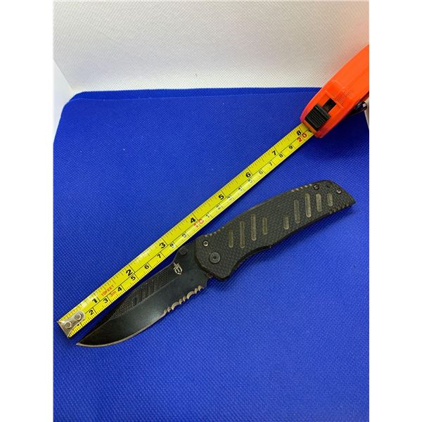 Gerber folding pocket knife with clip.