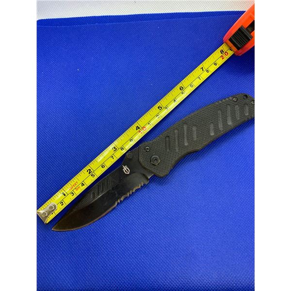 Gerber folding pocket knife with clip.