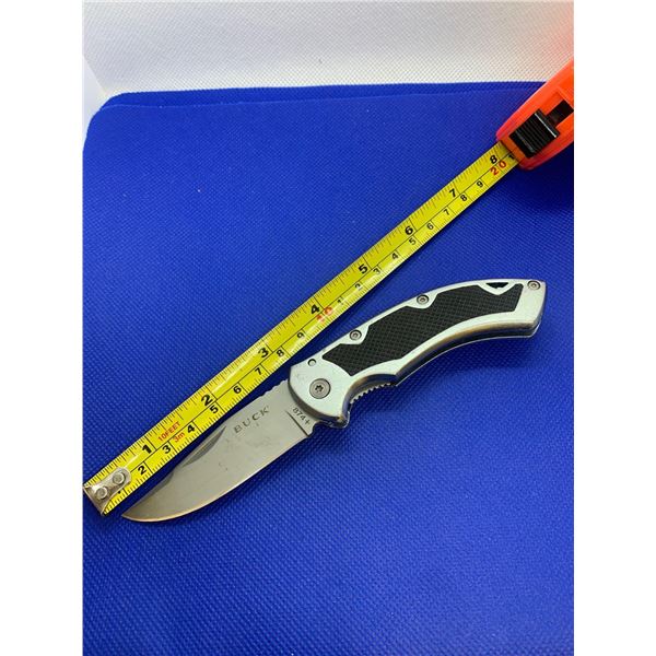 Buck folding pocket knife with clip.