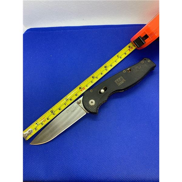 SOG folding pocket knife with clip.