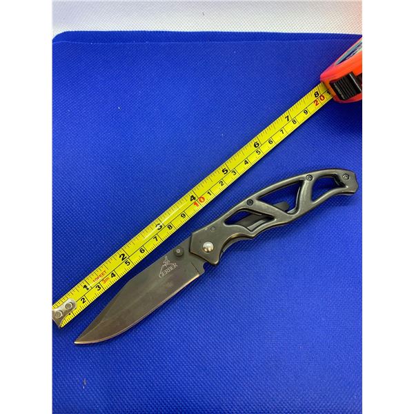 Gerber folding pocket knife with clip.