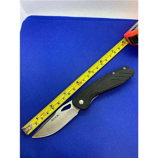 Buck folding pocket knife with clip.