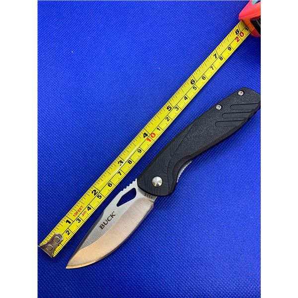 Buck folding pocket knife with clip.
