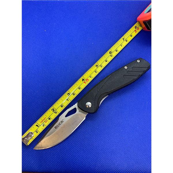 Buck folding pocket knife with clip.