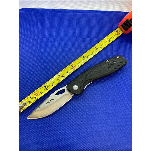 Buck folding pocket knife with clip.