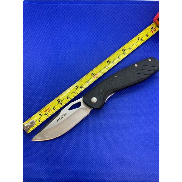 Buck folding pocket knife with clip.