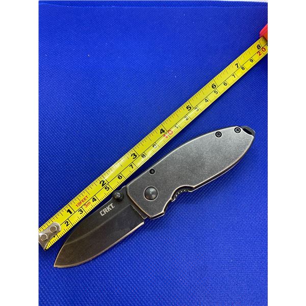 CRKT folding pocket knife with clip.