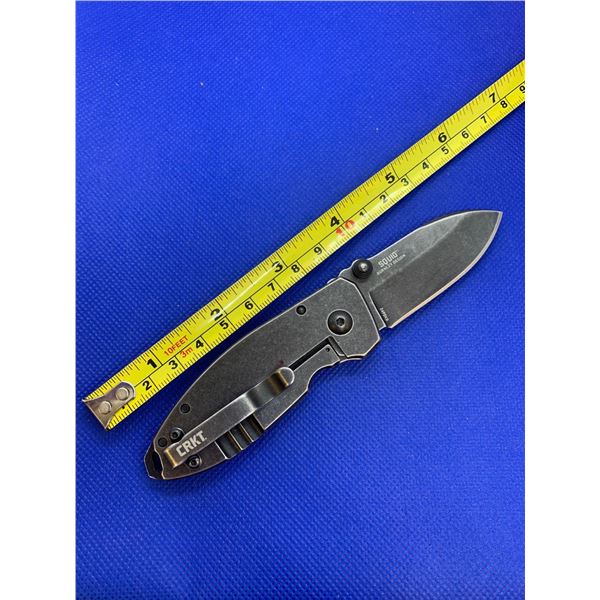 CRKT folding pocket knife with clip.