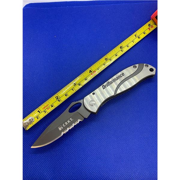 CRKT folding pocket knife with clip.