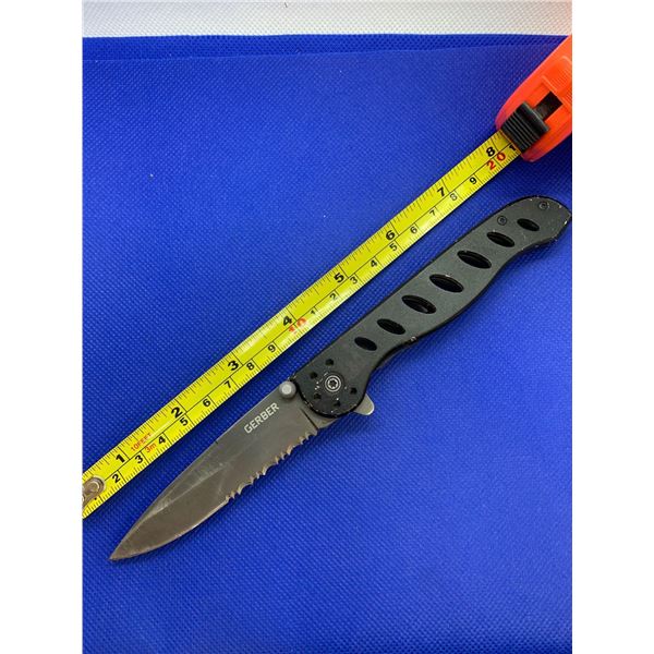 Gerber folding pocket knife with clip.